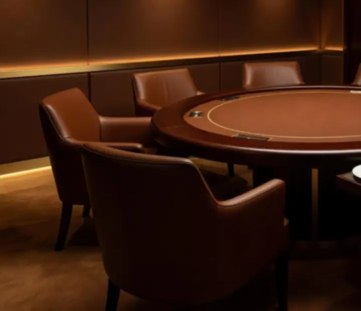 Private high roller card suite with elegant poker table and gourmet dining setup at Theam Berttable.